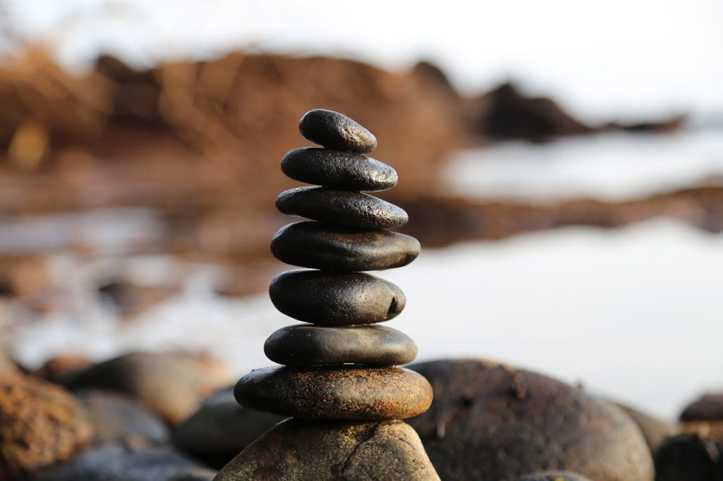 pile-of-rock-near-lake-355863 A stack of smooth stones artfully balanced by a waterside, evoking tranquility and zen.